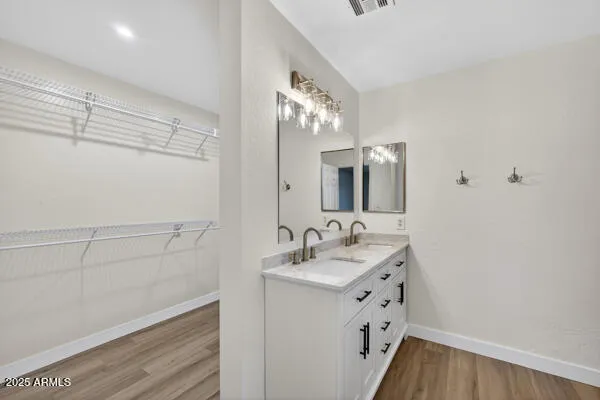a bathroom with a sink a vanity and a mirror