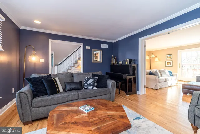 a living room with furniture a window and a fireplace
