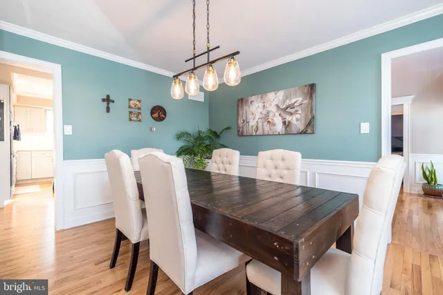 a kitchen with granite countertop a sink stove and cabinets