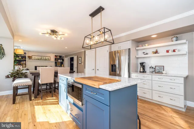 a bath tub sitting in a bathroom next to a window