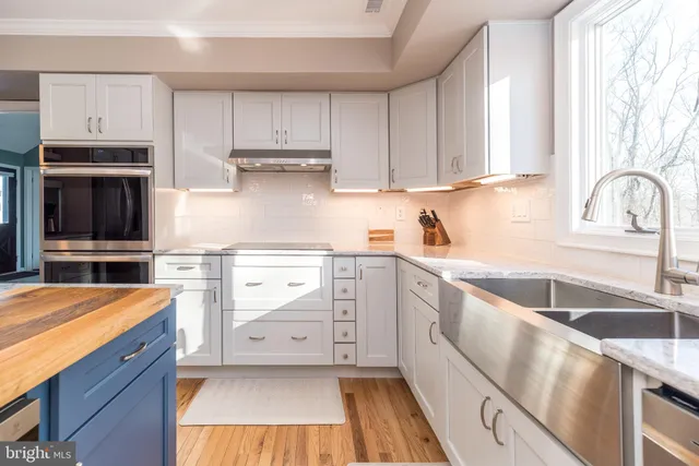 a bathroom with a sink vanity and a mirror