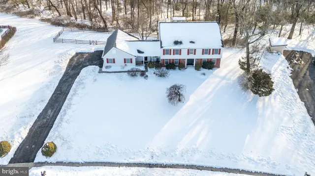 a living room with furniture a table and a flat screen tv