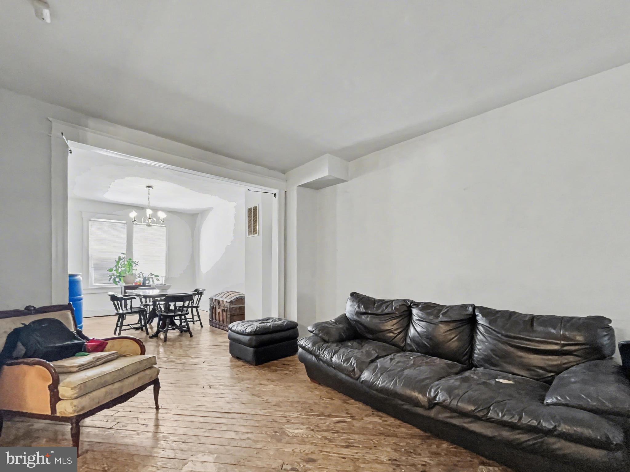 621 Edgewood Street Baltimore, MD 21229 - Photo 3 of 15 a living room with furniture and wooden floor