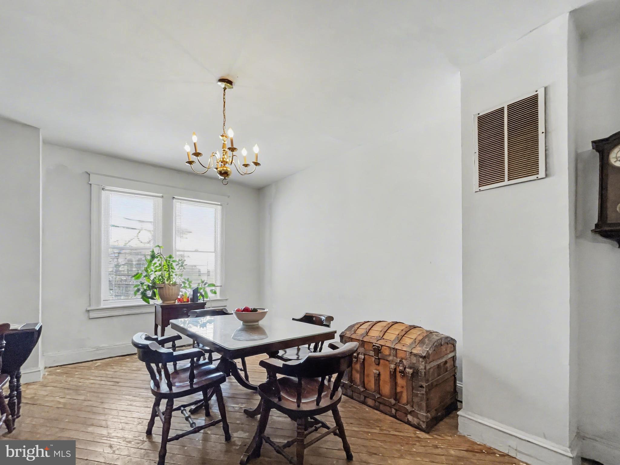 621 Edgewood Street Baltimore, MD 21229 - Photo 4 of 15 a view of a dining room with furniture and chandelier