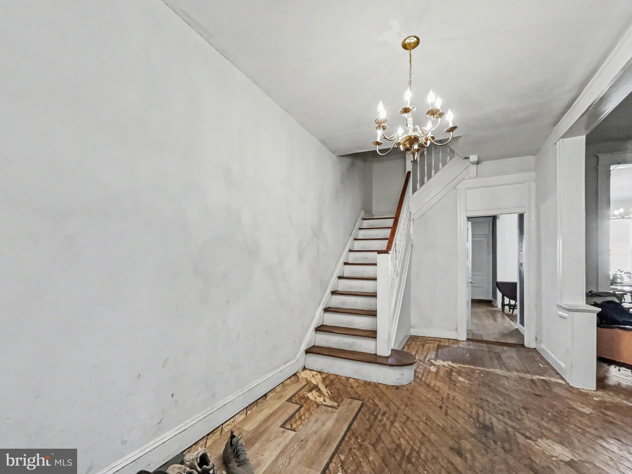 621 Edgewood Street Baltimore, MD 21229 - Photo 7 of 15 a view of entryway with stairs and chandelier