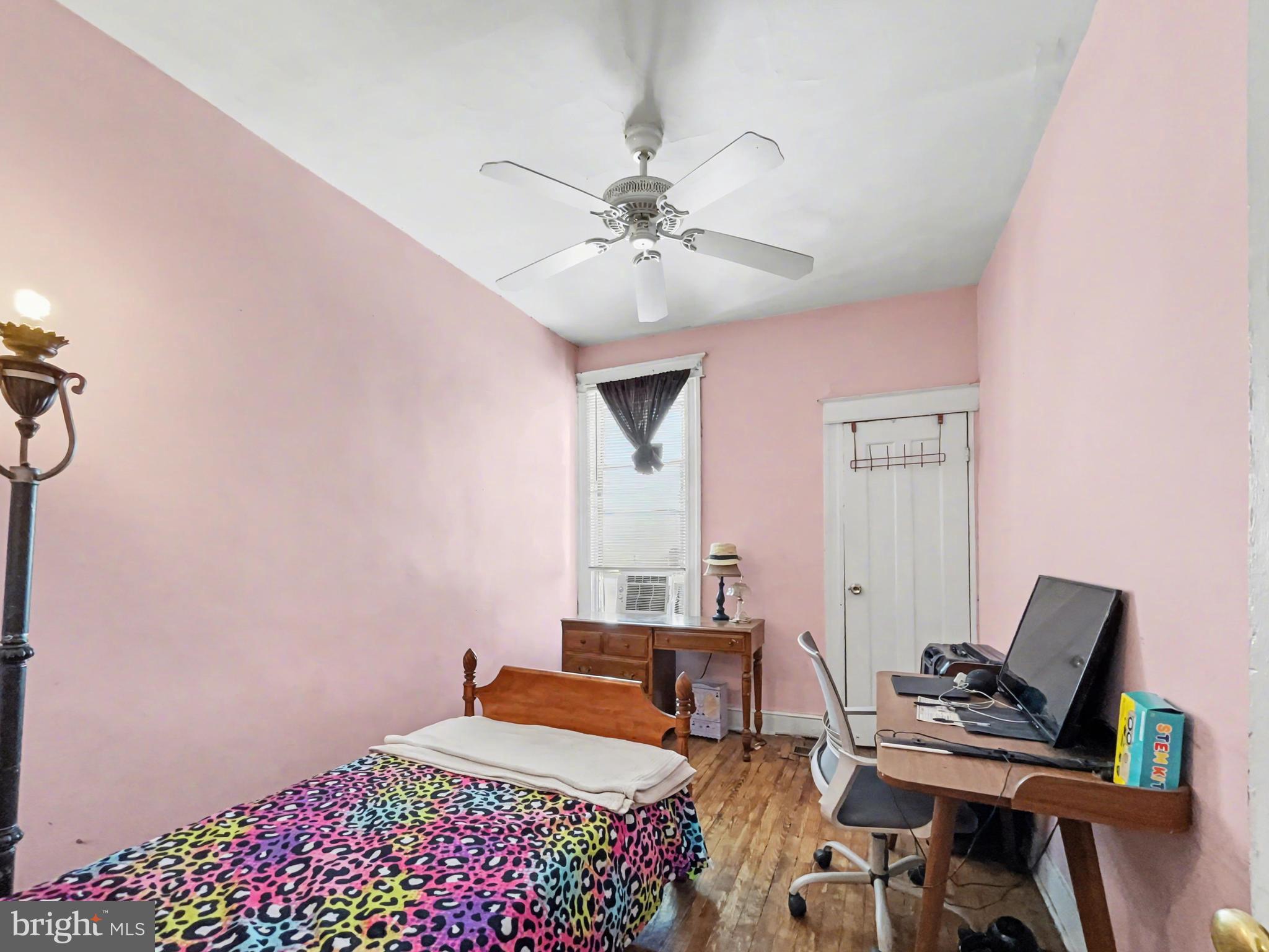 621 Edgewood Street Baltimore, MD 21229 - Photo 9 of 15 a bedroom with furniture and a chandelier fan
