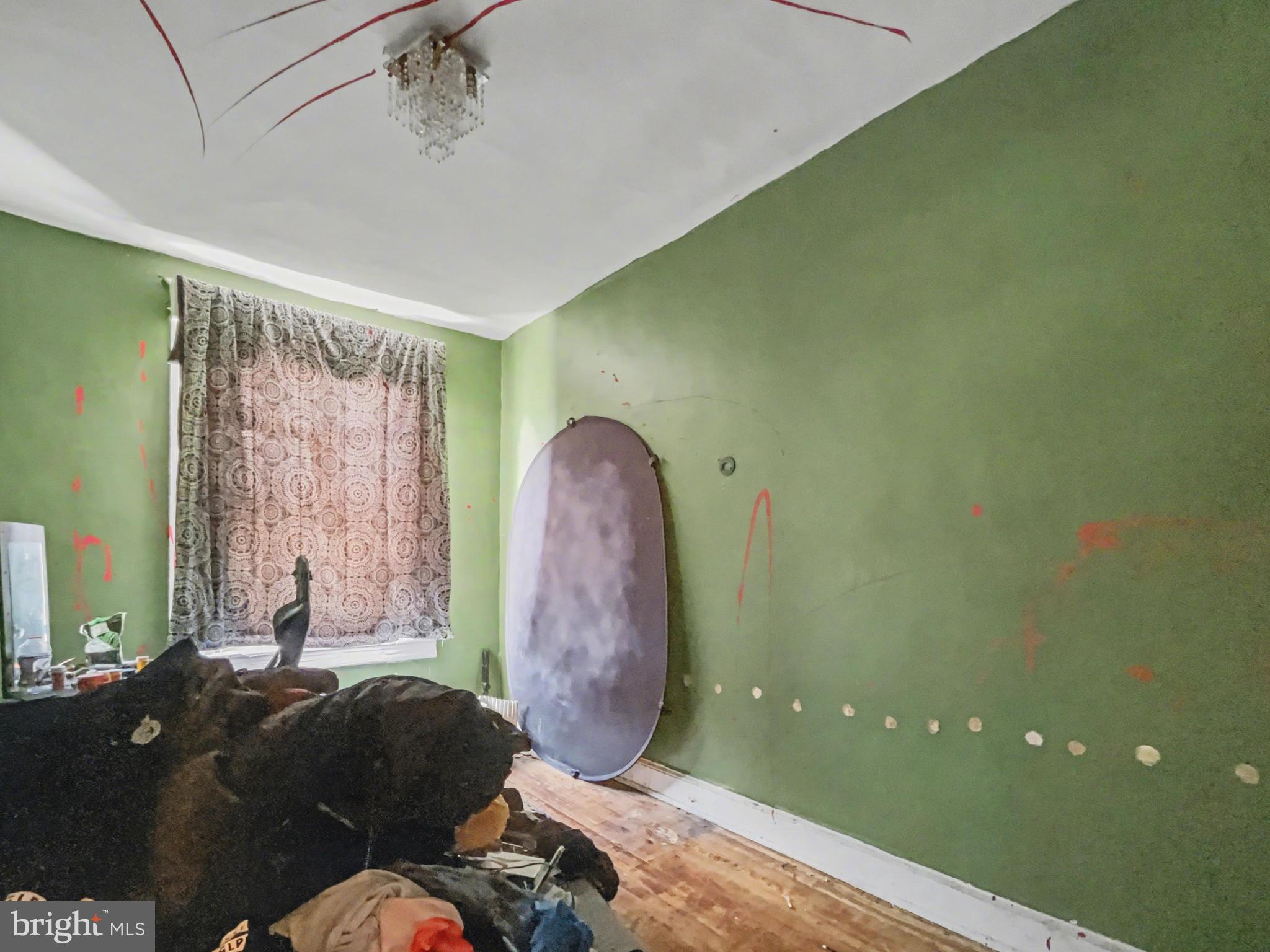 621 Edgewood Street Baltimore, MD 21229 - Photo 10 of 15 a living room with furniture and a window