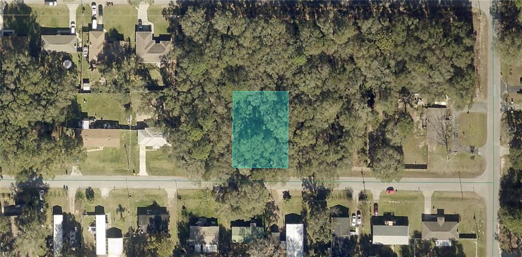 Southwest 108th Street Dunnellon, FL 34432 - Photo 1 of 4 an aerial view of a residential apartment building with a yard