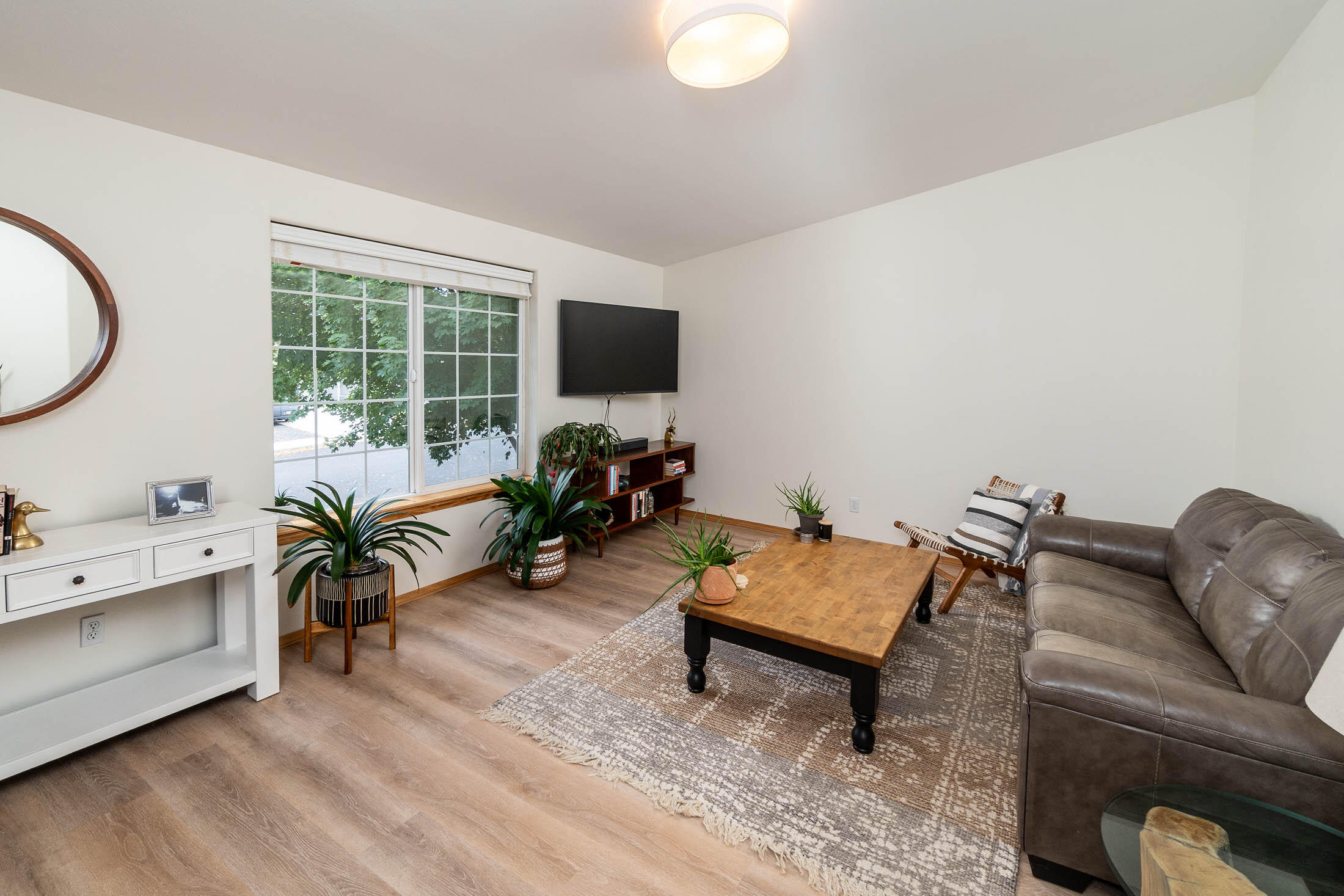 773 Northeast Mason Road Bend, OR 97701 - Photo 2 of 25 Light and bright living room with skylights and a large window