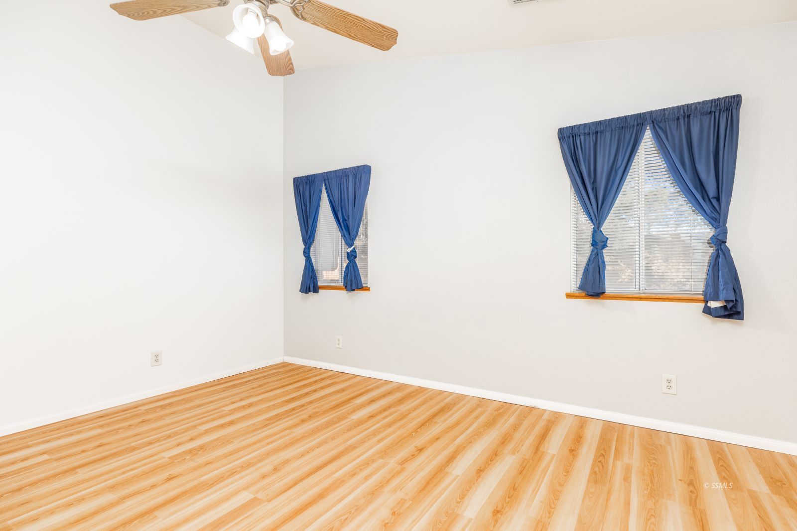 528 Amanda Street Ridgecrest, CA 93555 - Photo 14 of 30 a view of a room with wooden floor and white walls