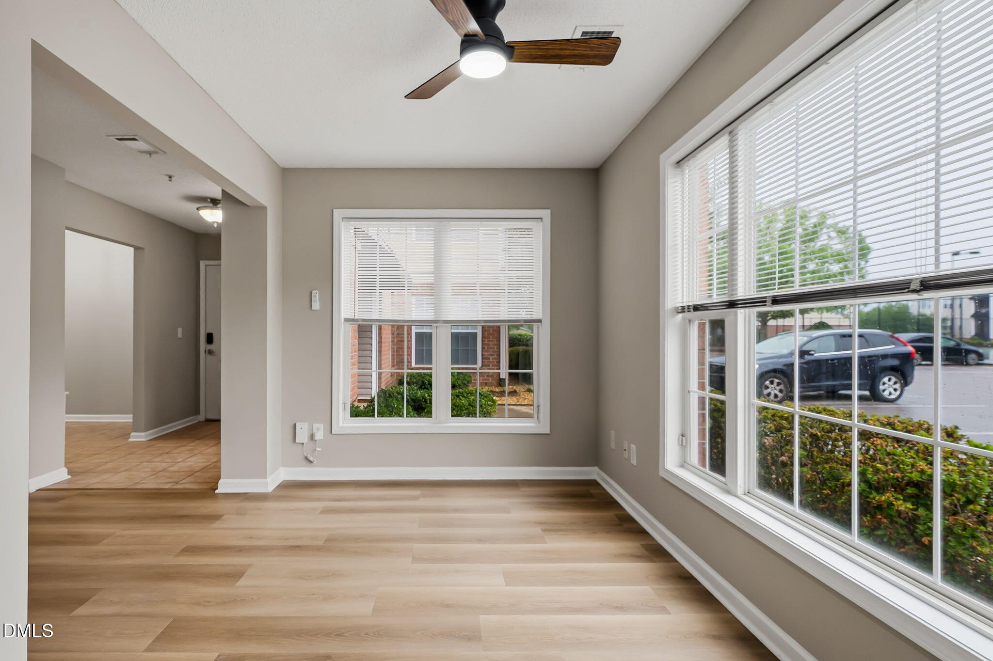 2501 Huntscroft Lane, Unit 100 Raleigh, NC 27617 - Photo 18 of 31 a view of a livingroom with a ceiling fan and window