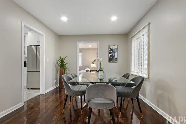 a view of a dining room with furniture and window