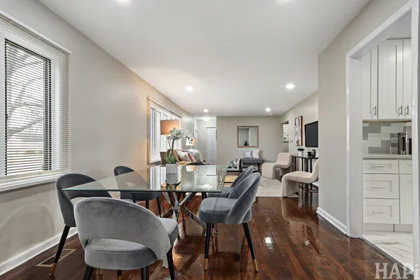 a view of a dining room with furniture and window