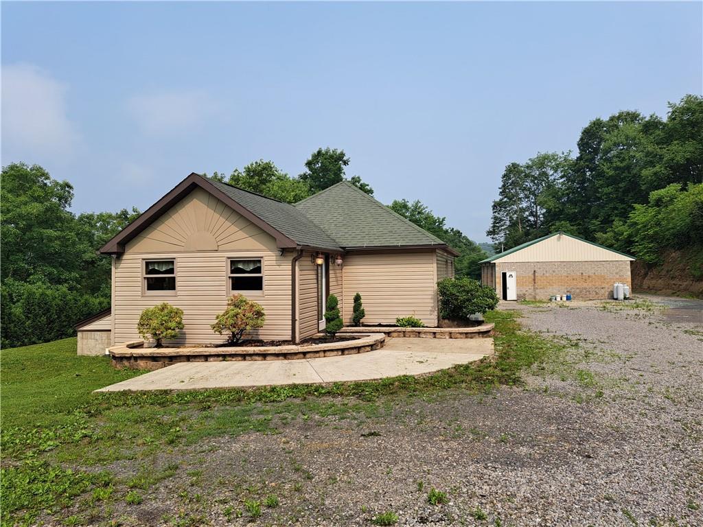 117 Slagle Heights Lane Templeton, PA 16259 - Photo 1 of 10 a front view of a house with a yard