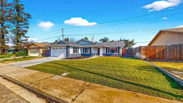 a front view of a house with yard