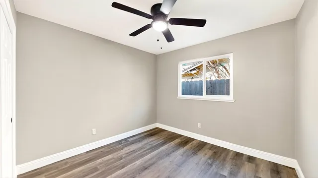 a view of kitchen with white cabinets