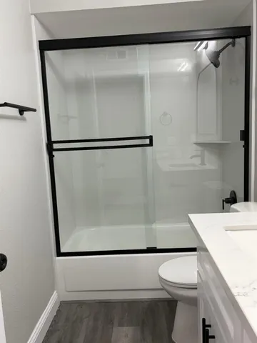 a view of house with outdoor space and parking