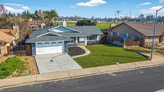 a view of table chair with wooden floor
