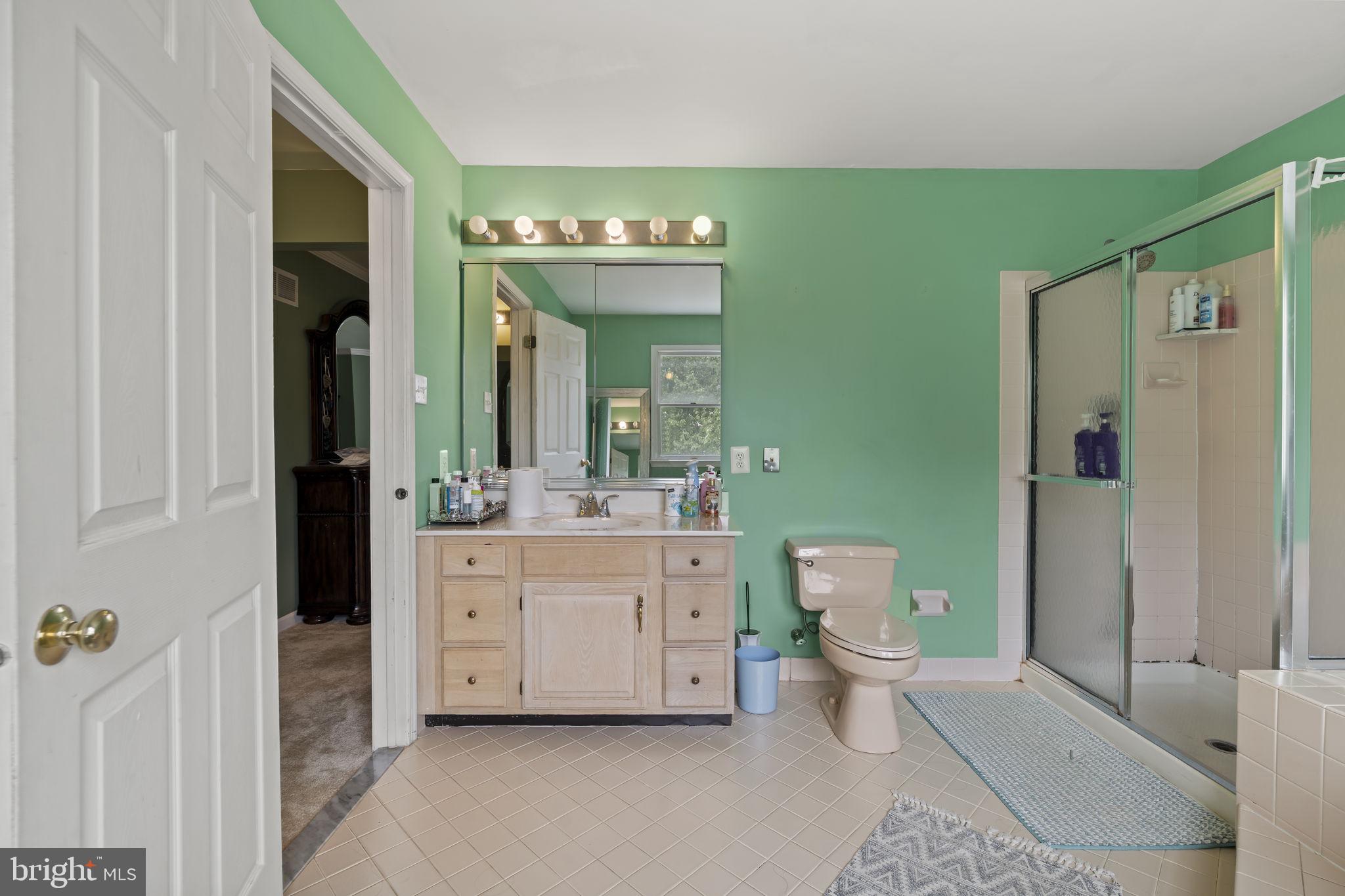 1015 Redtail Road Eagleville, PA 19403 - Photo 35 of 53 Serene green bathroom retreat.