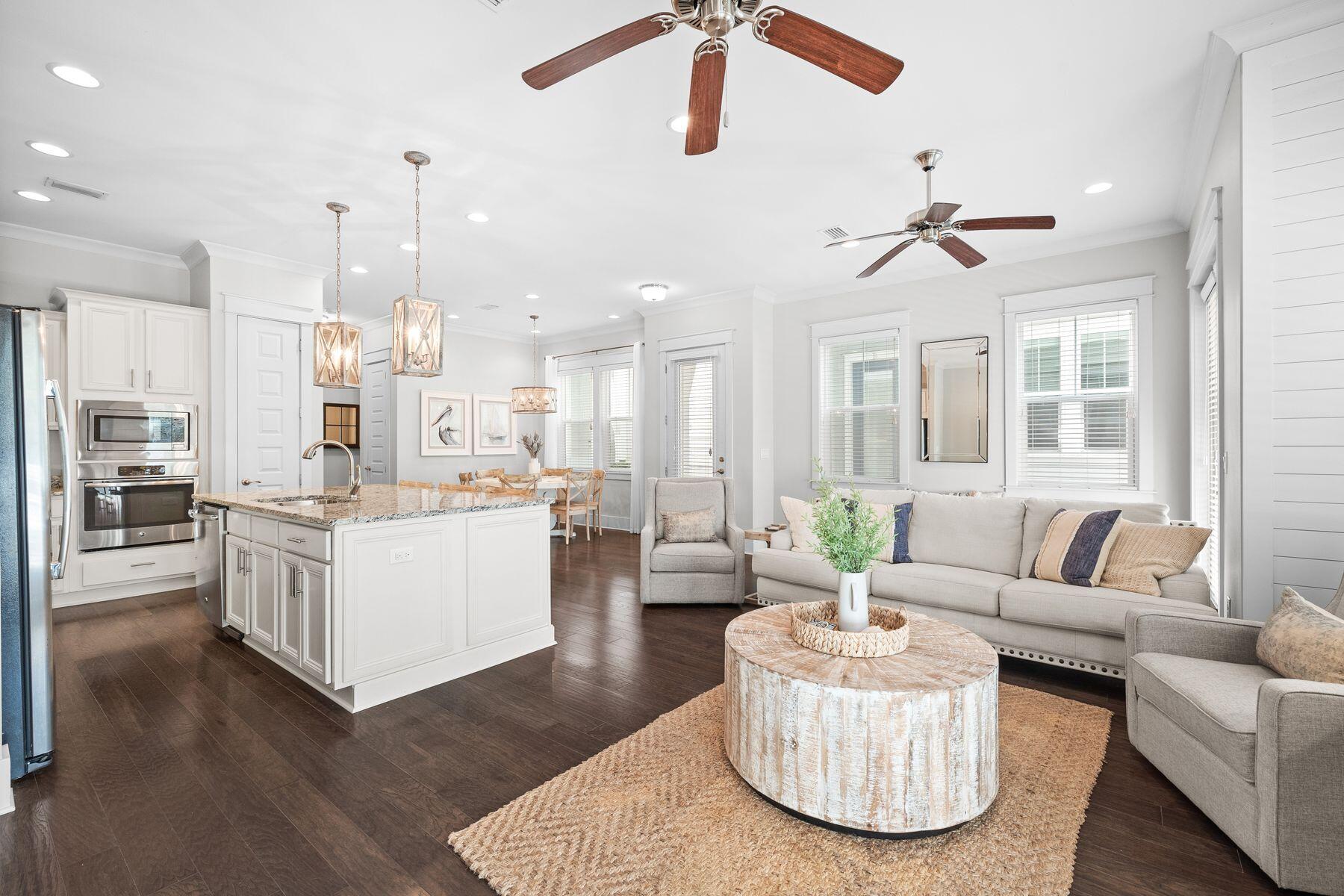175 Milestone Drive, Unit A Inlet Beach, FL 32461 - Photo 3 of 22 a living room with kitchen island furniture and a chandelier