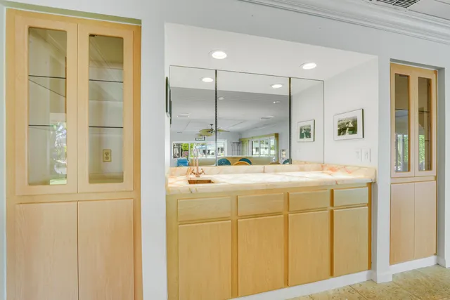 a bathroom with a sink a mirror and a bathtub