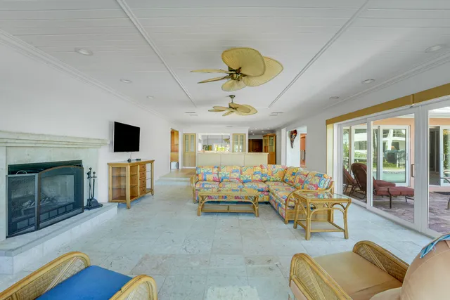 a living room with furniture fireplace and flat screen tv