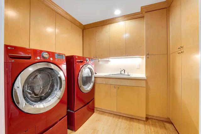 a bed room with a bed and a chandelier
