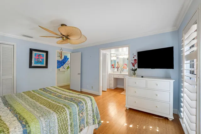 a bathroom with a sink a vanity a mirror a bathtub and shower