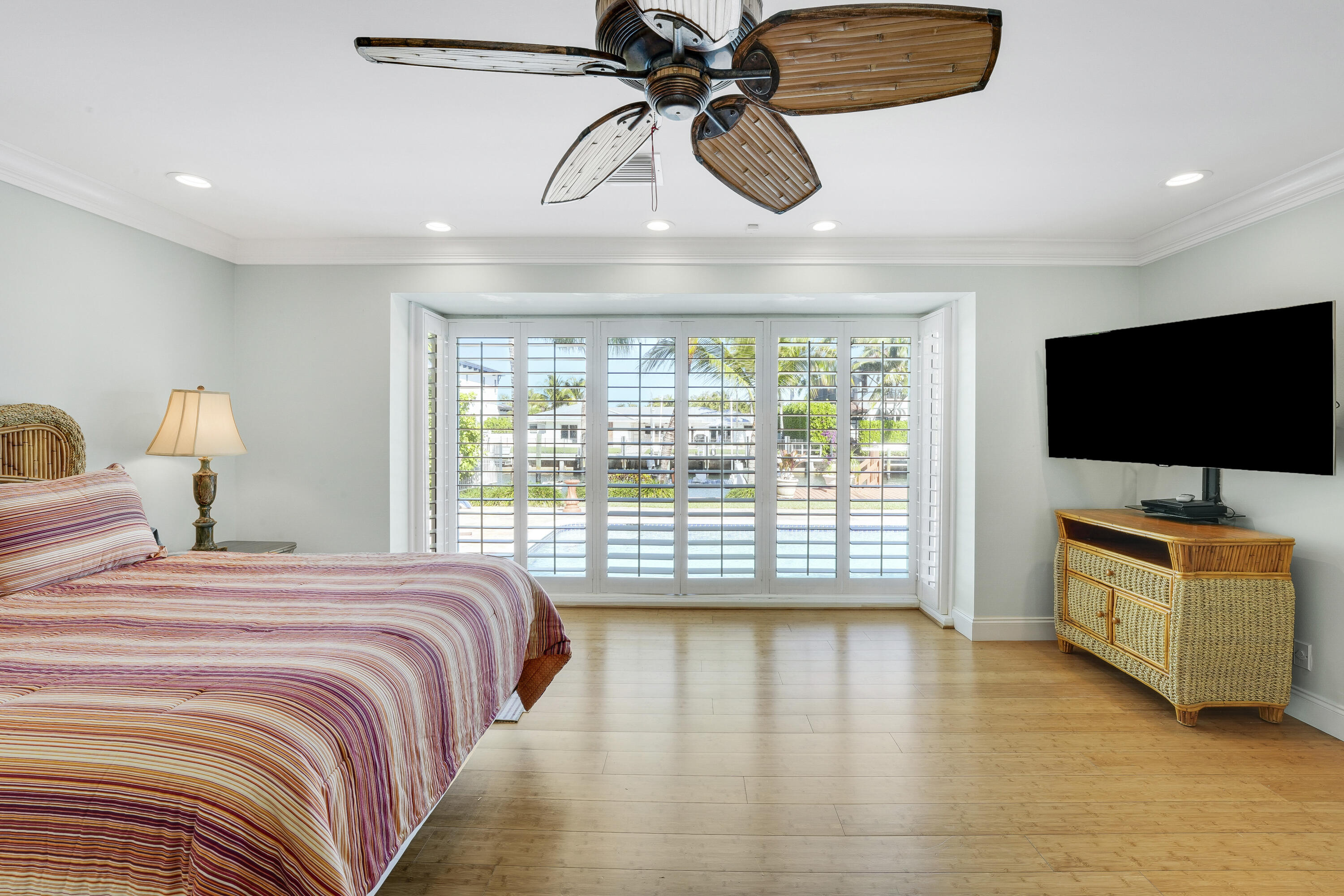 1080 Fairview Lane Singer Island, FL 33404 - Photo 43 of 51 a bedroom with a bed and a flat screen tv