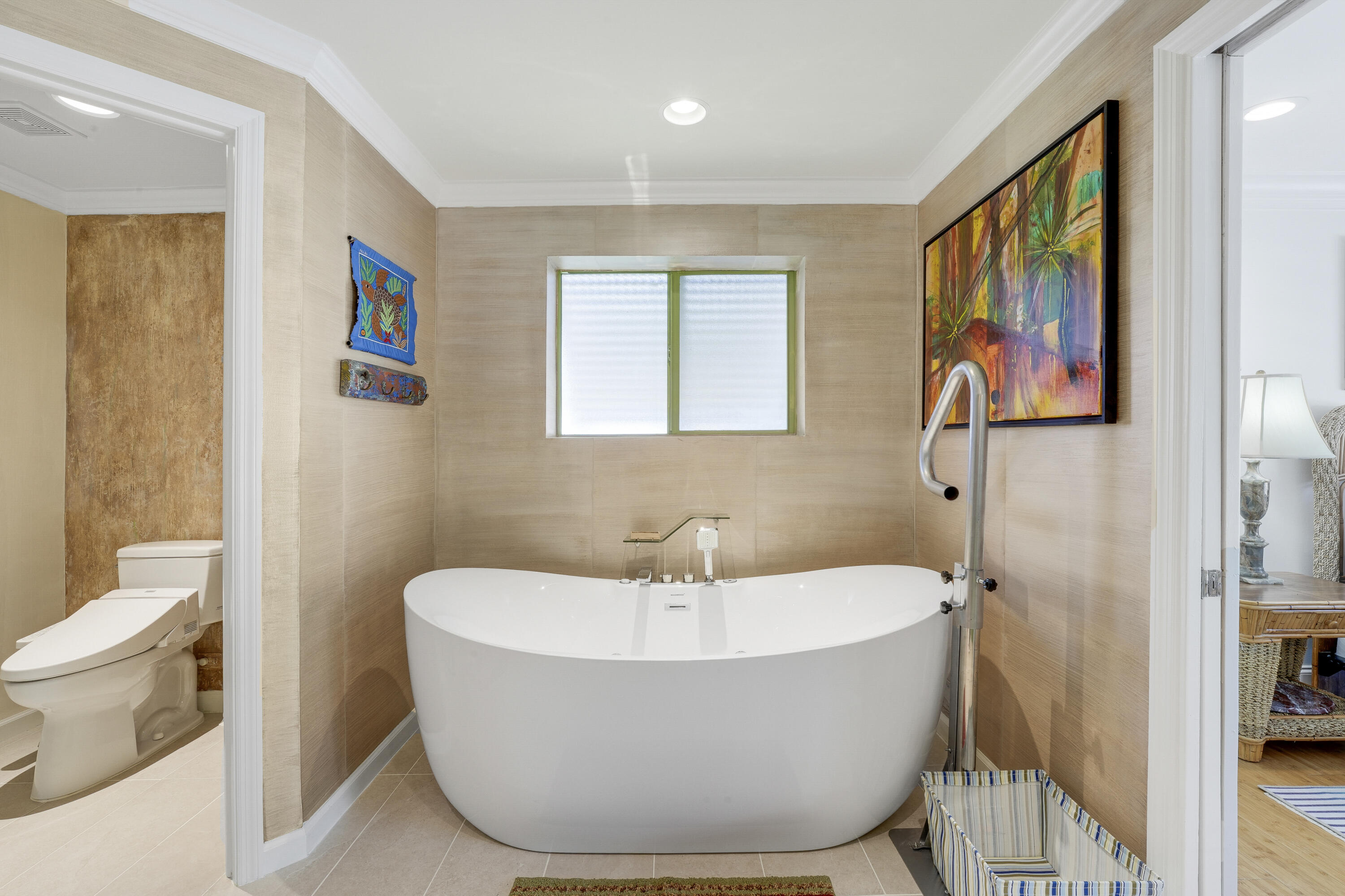1080 Fairview Lane Singer Island, FL 33404 - Photo 48 of 51 a bathroom with a bathtub and a toilet