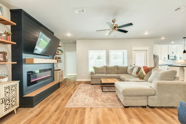 a living room with furniture and a flat screen tv