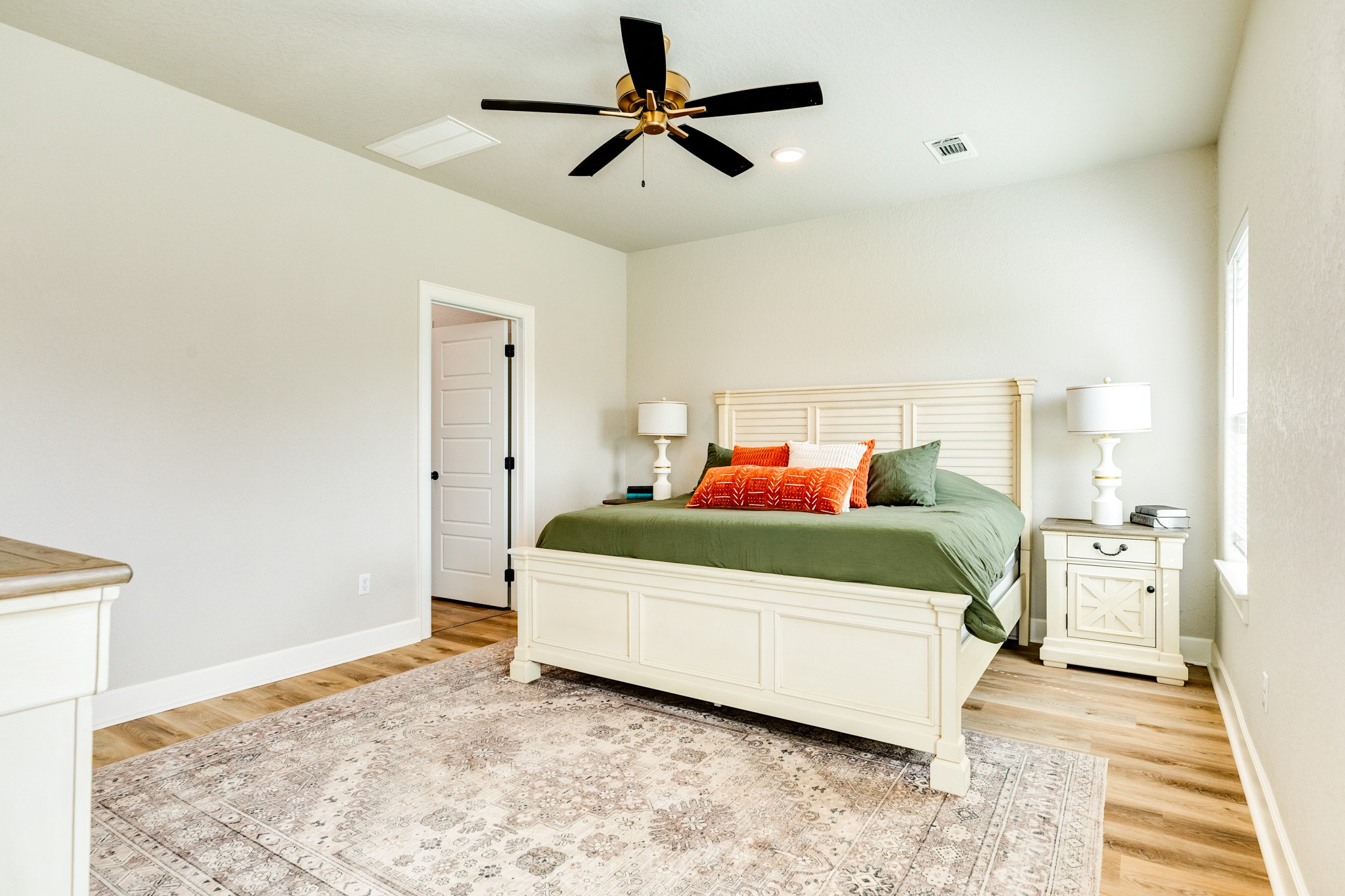 628 Greystone Lane Angleton, TX 77515 - Photo 21 of 33 a bedroom with a bed and a chandelier fan