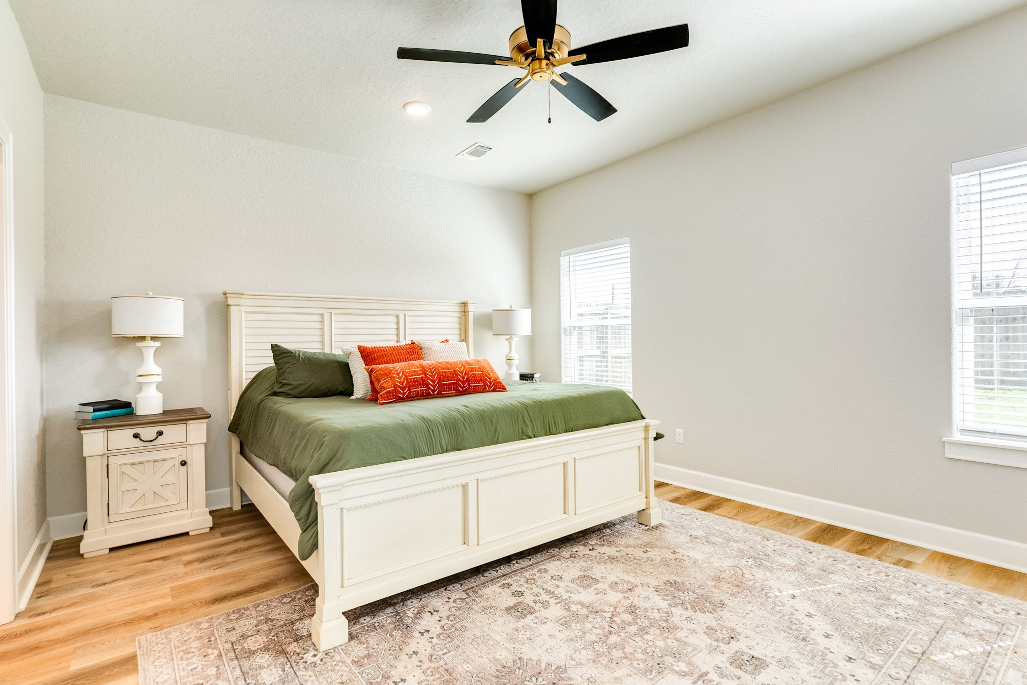 628 Greystone Lane Angleton, TX 77515 - Photo 22 of 33 a bedroom with a bed and a window
