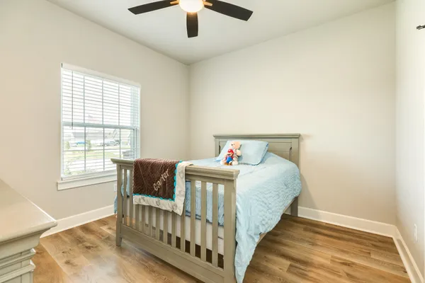 a bedroom with a bed and window