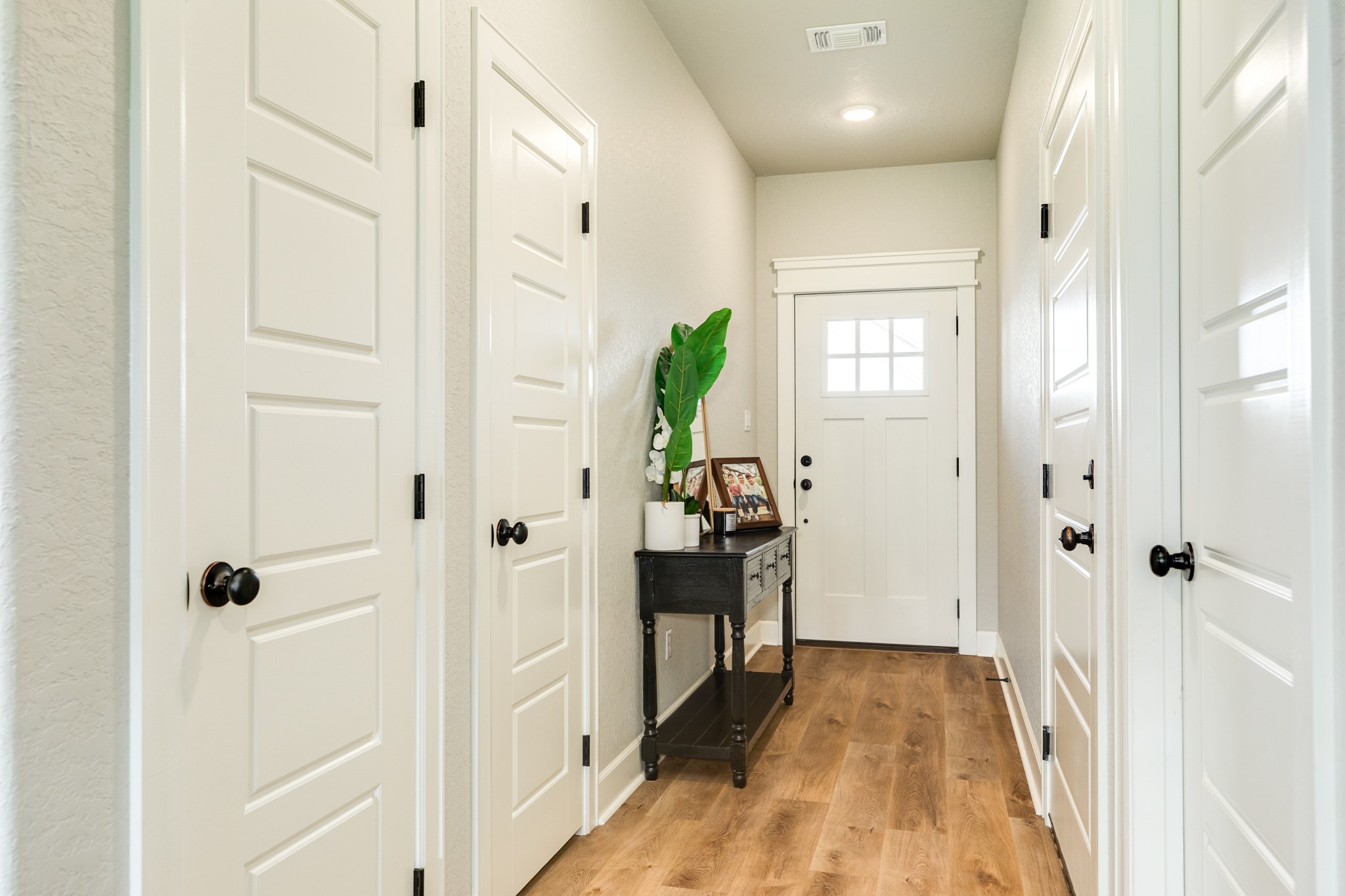 628 Greystone Lane Angleton, TX 77515 - Photo 33 of 33 a view of a hallway with wooden floor and closet area