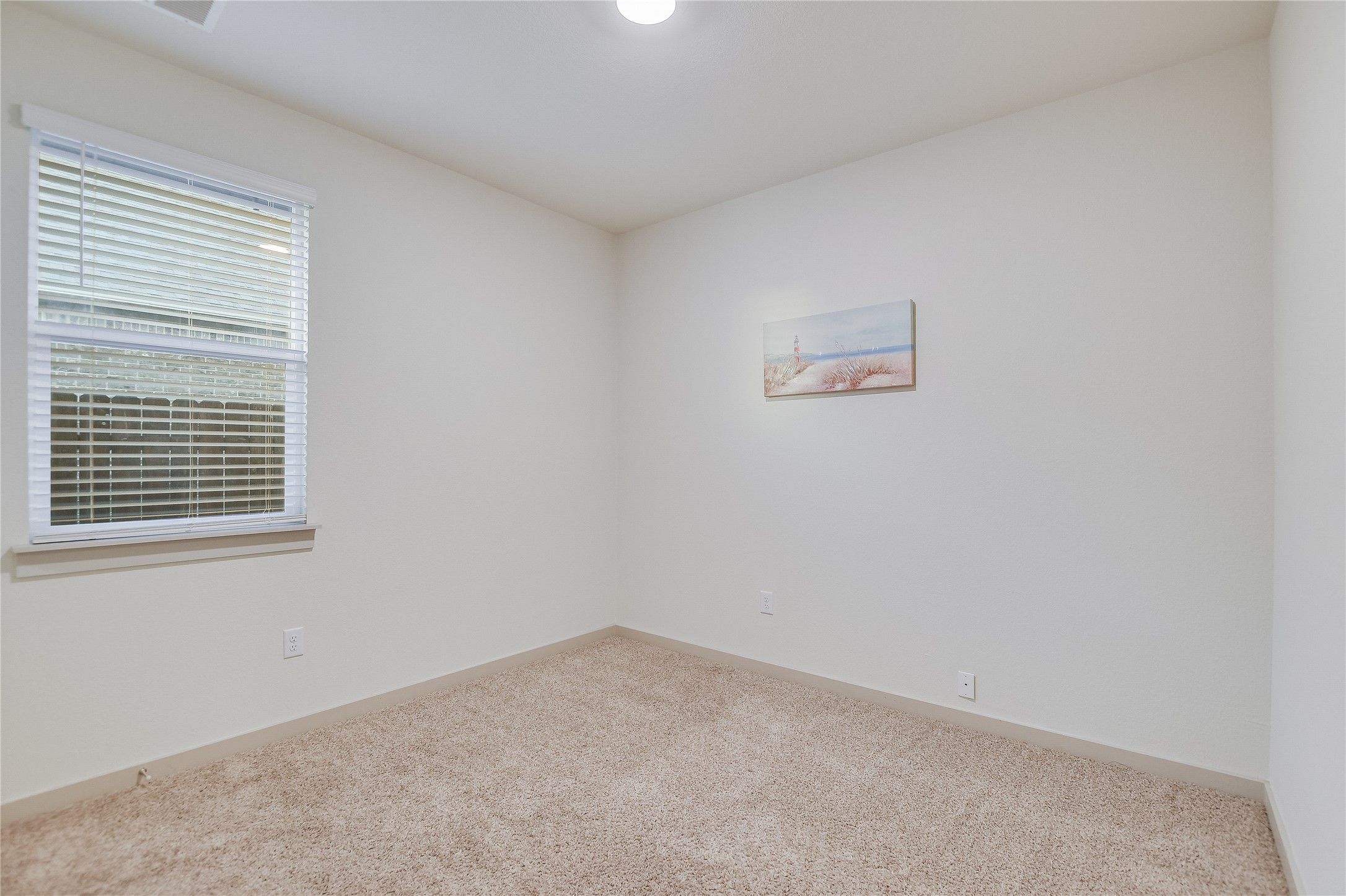 2244 Alamar Walk Leander, TX 78641 - Photo 12 of 22 an empty room with a window
