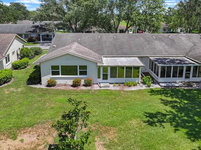 a aerial view of a house with a yard patio and deck