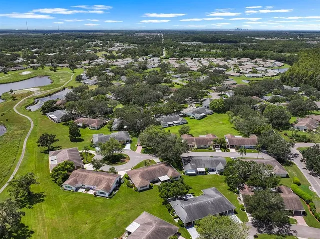 an aerial view of residential houses with outdoor space