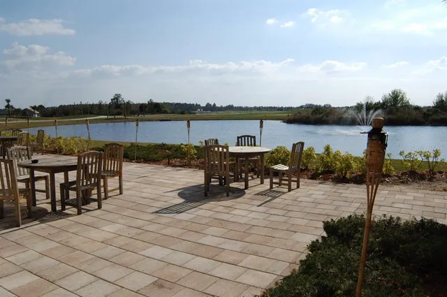 a view of a lake with outdoor seating space