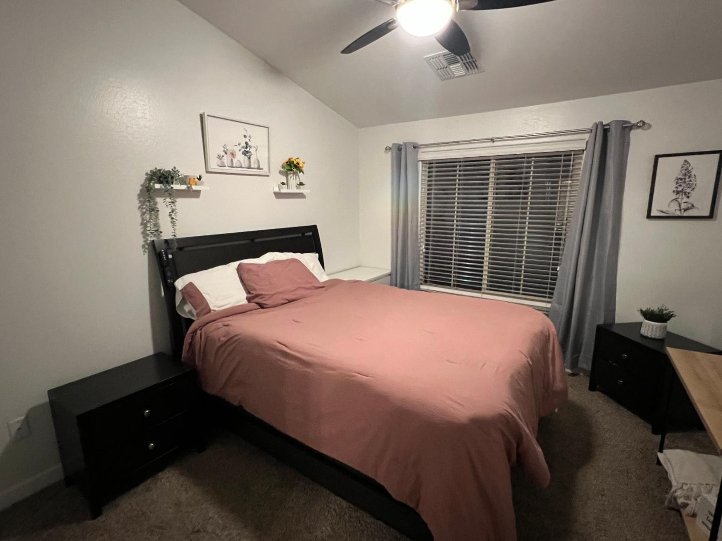 240 West Juniper Avenue, Unit 1089 Gilbert, AZ 85233 - Photo 11 of 24 a bedroom with a bed and painting on the wall