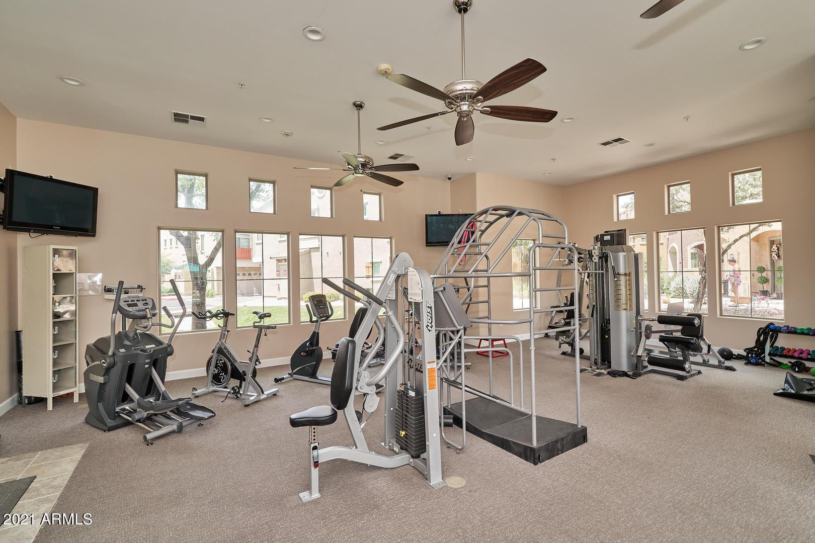 240 West Juniper Avenue, Unit 1089 Gilbert, AZ 85233 - Photo 23 of 24 a view of a room with gym equipment