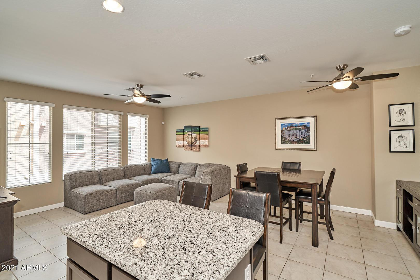 240 West Juniper Avenue, Unit 1089 Gilbert, AZ 85233 - Photo 8 of 24 a view of a livingroom with furniture and window