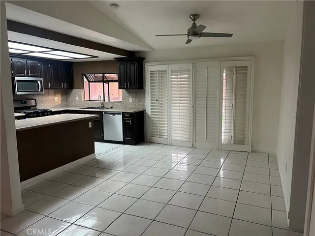 a kitchen with stainless steel appliances granite countertop a sink and cabinets
