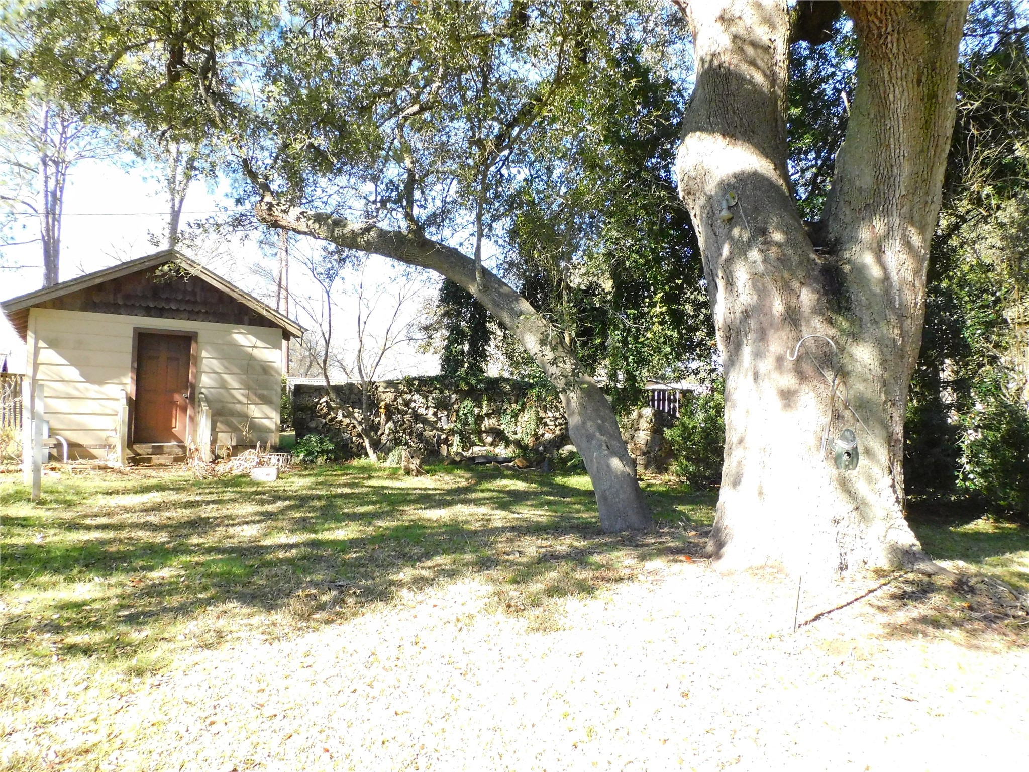 2408 Gun And Rod Road Brenham, TX 77833 - Photo 12 of 16 a view of a fountain in the middle of a yard