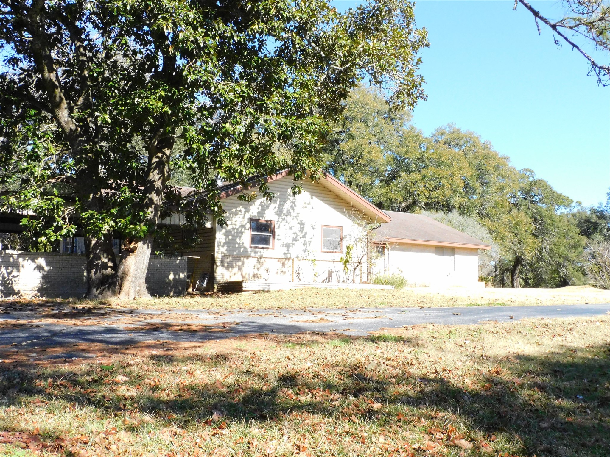 2408 Gun And Rod Road Brenham, TX 77833 - Photo 14 of 16 a view of a house with snow on the tree