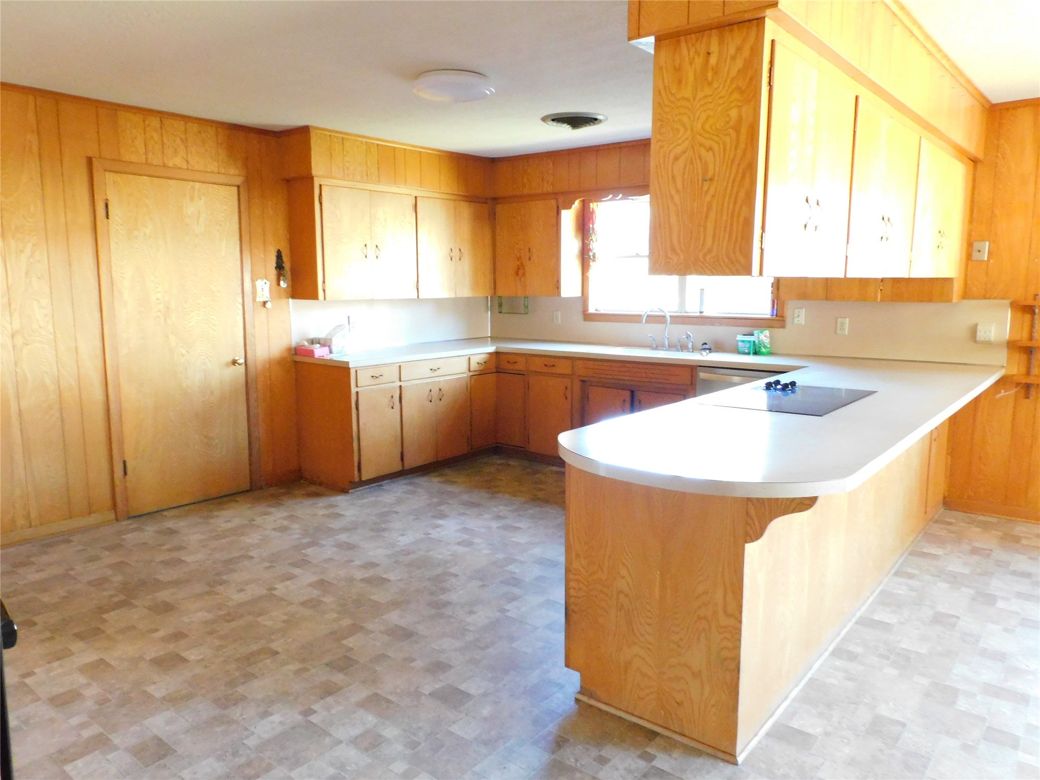 2408 Gun And Rod Road Brenham, TX 77833 - Photo 6 of 16 a kitchen that has a sink and a stove in it