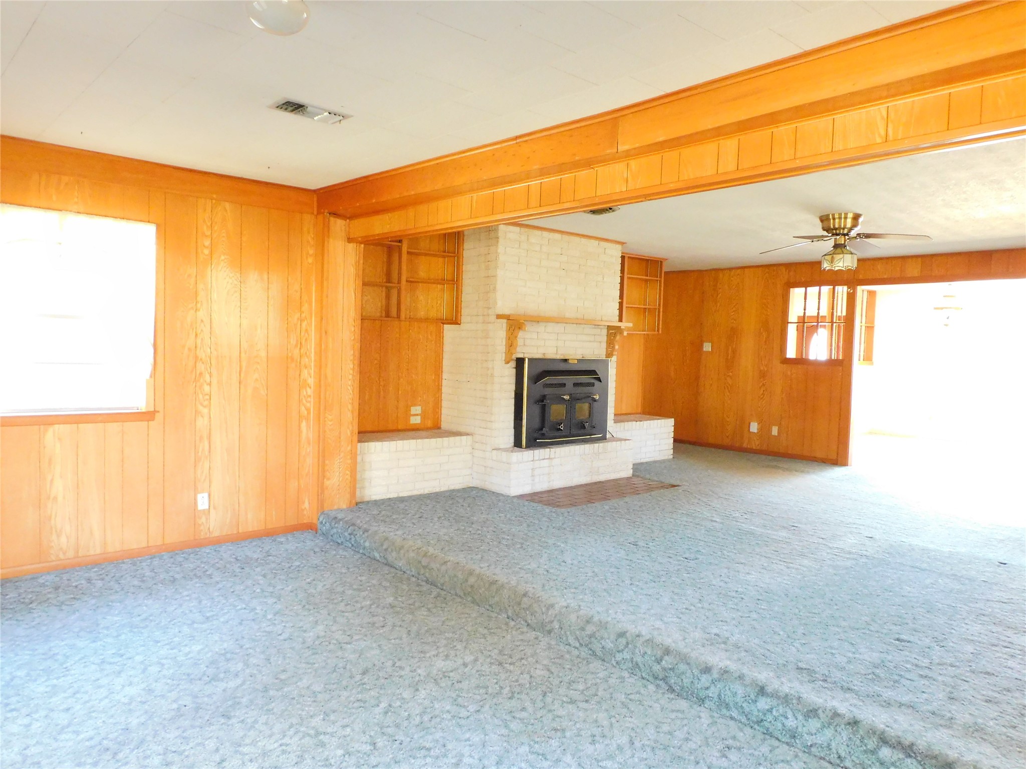 2408 Gun And Rod Road Brenham, TX 77833 - Photo 7 of 16 a view of an empty room with a fireplace