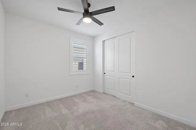 a bathroom with a sink toilet a mirror and shower