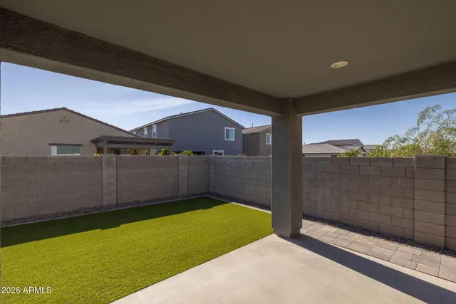 a view of a swimming pool with outdoor seating