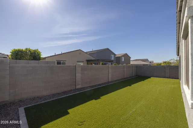 an empty room with wooden floor and door